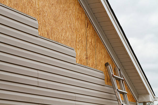 Professional Storm Damage Siding Repair technician working in Piedmont, OH